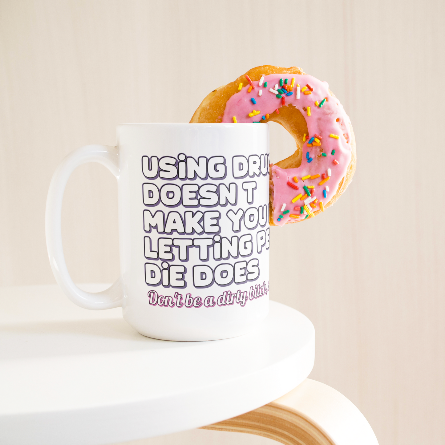 Using_Drugs_Doesnt_Make_You_Dirty_Mug_15ozWhiteMugLifetsyleDonutLH_Mockup.png